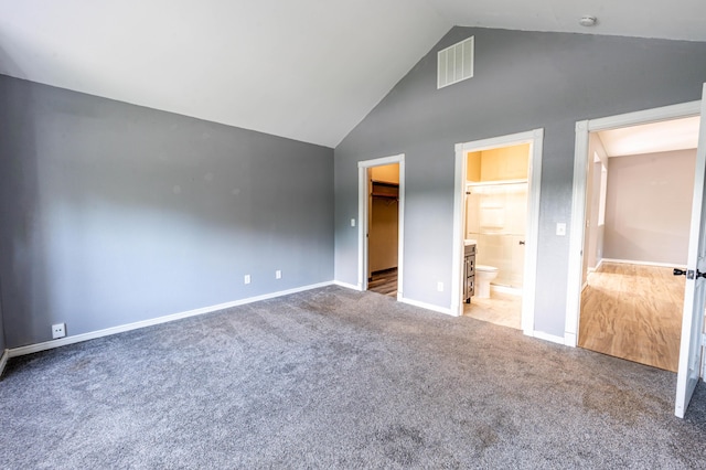 4147 E Kellis Ct, Springfield, MO 65802 - unfurnished bedroom with high vaulted ceiling, carpet floors, a walk in closet, and connected bathroom