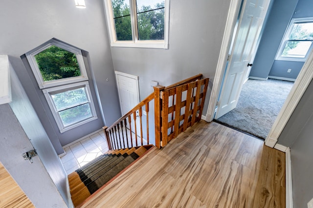 4147 E Kellis Ct, Springfield, MO 65802 - stairs featuring wood finished floors and a towering ceiling