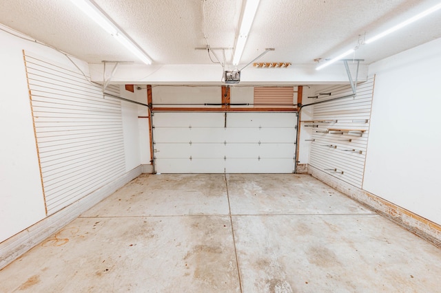 4147 E Kellis Ct, Springfield, MO 65802 - garage featuring a garage door opener and baseboards