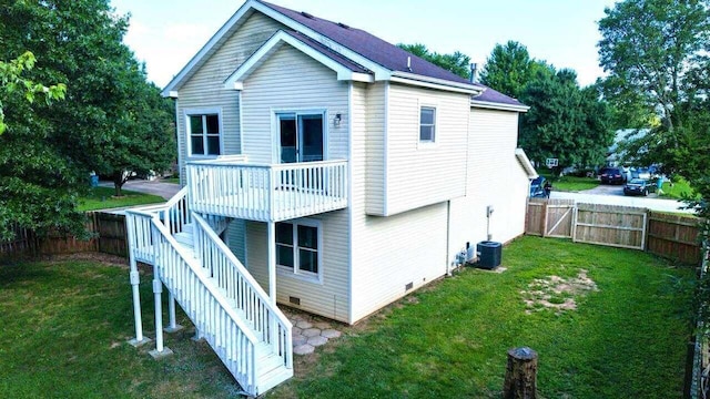 4147 E Kellis Ct, Springfield, MO 65802 - back of house with stairs, a fenced backyard, crawl space, and a wooden deck