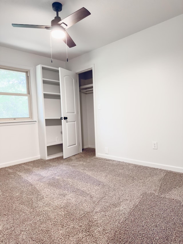 105 Horseshoe Dr, Nixa, MO 65714 - unfurnished bedroom with carpet flooring, a ceiling fan, and two closets