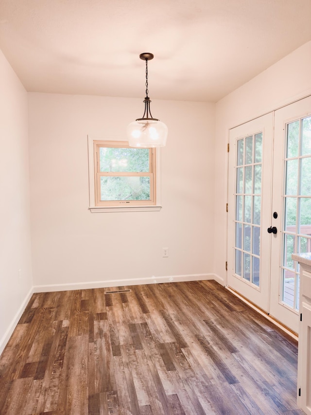 105 Horseshoe Dr, Nixa, MO 65714 - unfurnished dining area featuring wood finished floors and french doors