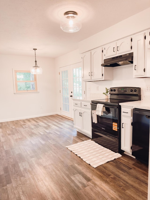 105 Horseshoe Dr, Nixa, MO 65714 - kitchen featuring black appliances, under cabinet range hood, wood finished floors, and white cabinetry