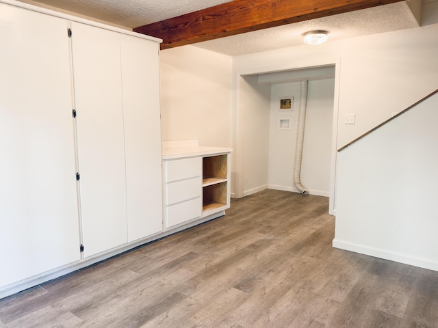 105 Horseshoe Dr, Nixa, MO 65714 - below grade area with wood finished floors and a textured ceiling