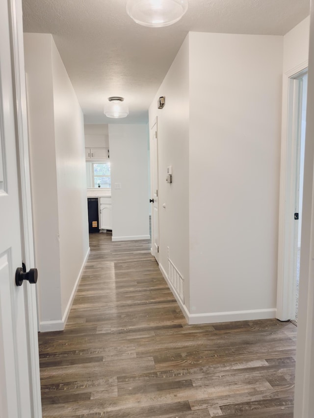 105 Horseshoe Dr, Nixa, MO 65714 - hall featuring dark wood finished floors and baseboards
