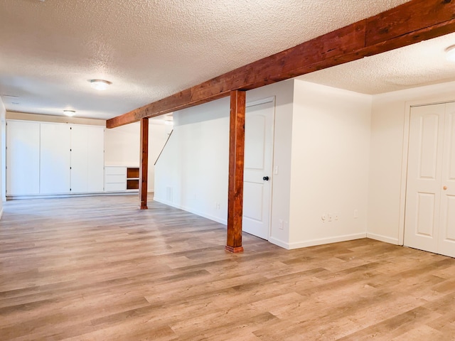 105 Horseshoe Dr, Nixa, MO 65714 - finished basement featuring a textured ceiling and light wood-style flooring