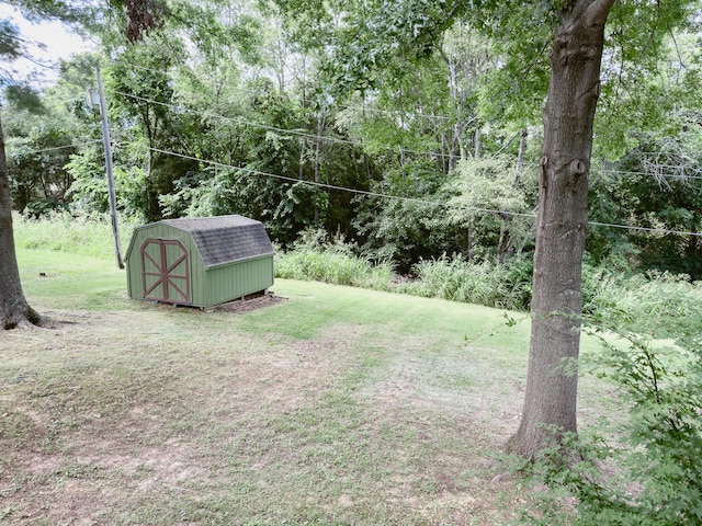 105 Horseshoe Dr, Nixa, MO 65714 - view of green lawn with a storage shed