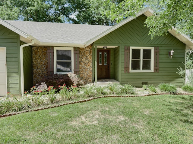 105 Horseshoe Dr, Nixa, MO 65714 - view of front of home with stone siding, a front yard, and roof with shingles