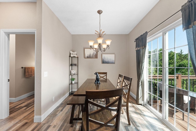 2505 Talking Rocks Rd, Branson West, MO 65737 - dining room featuring a chandelier and wood finished floors