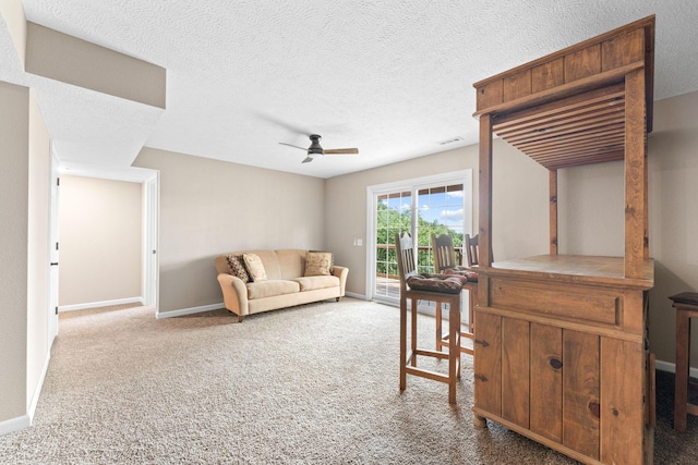 2505 Talking Rocks Rd, Branson West, MO 65737 - carpeted living room with ceiling fan and a textured ceiling