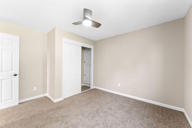 2505 Talking Rocks Rd, Branson West, MO 65737 - unfurnished bedroom featuring carpet floors, ceiling fan, and a closet