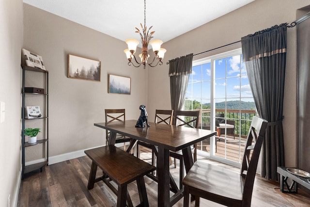 2505 Talking Rocks Rd, Branson West, MO 65737 - dining room with wood finished floors and a chandelier