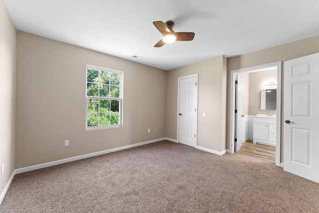 2505 Talking Rocks Rd, Branson West, MO 65737 - unfurnished bedroom with carpet flooring, connected bathroom, and a ceiling fan