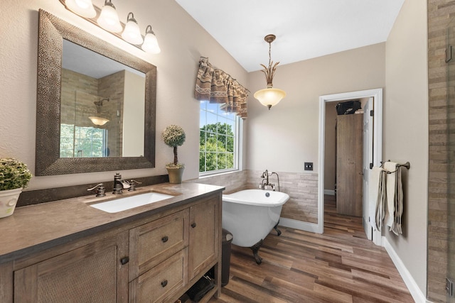 2505 Talking Rocks Rd, Branson West, MO 65737 - bathroom with vanity, a soaking tub, wood finished floors, a stall shower, and vaulted ceiling