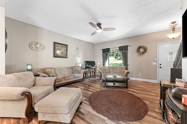 2505 Talking Rocks Rd, Branson West, MO 65737 - living area with a ceiling fan, wood finished floors, and a textured ceiling