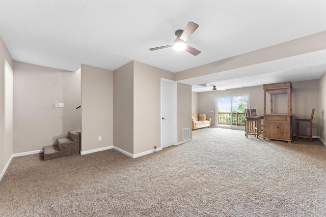 2505 Talking Rocks Rd, Branson West, MO 65737 - unfurnished living room featuring ceiling fan, carpet, and stairs