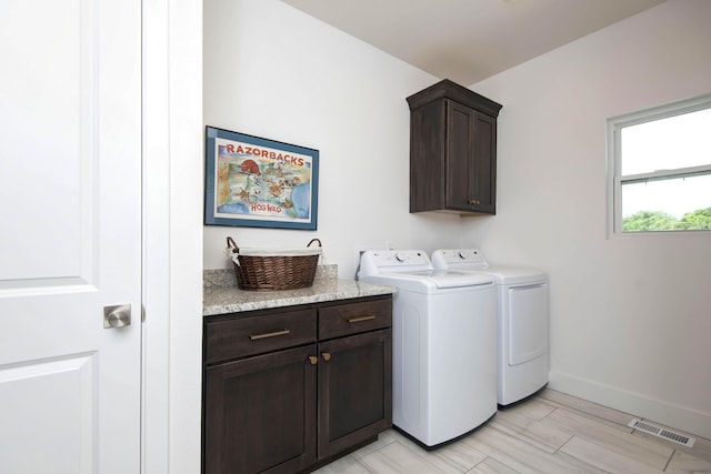 1604 N Bristol Ave, Springfield, MO 65802 - laundry area with cabinet space and washer and dryer