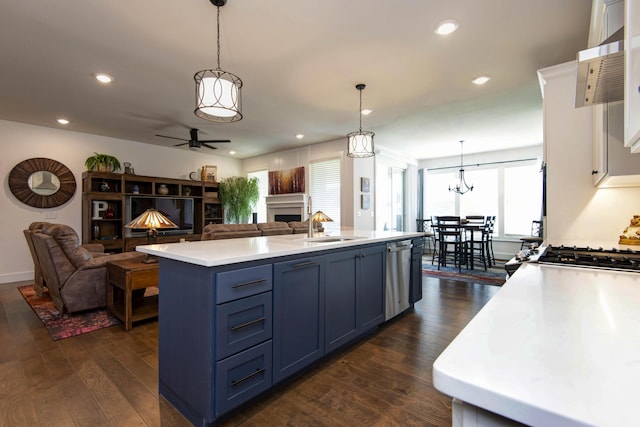 1604 N Bristol Ave, Springfield, MO 65802 - kitchen with dishwasher, open floor plan, a fireplace, blue cabinetry, and recessed lighting