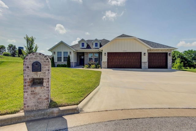 1604 N Bristol Ave, Springfield, MO 65802 - view of front of property with an attached garage, board and batten siding, and a front lawn