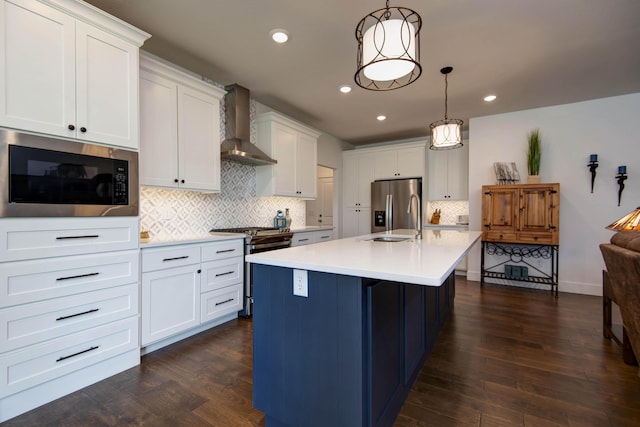 1604 N Bristol Ave, Springfield, MO 65802 - kitchen with wall chimney range hood, stainless steel appliances, light countertops, decorative backsplash, and dark wood-style floors