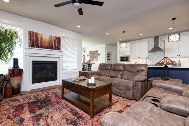 1604 N Bristol Ave, Springfield, MO 65802 - living area with ceiling fan, a glass covered fireplace, and recessed lighting