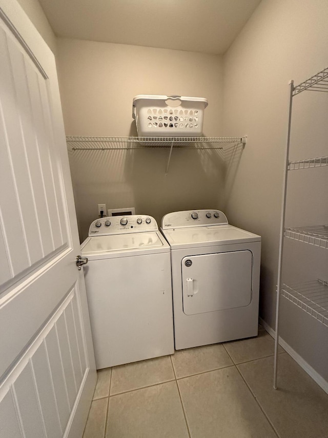 1352 N Sandy Creek Cir Unit 3, Nixa, MO 65714 - laundry room with washing machine and dryer and light tile patterned floors