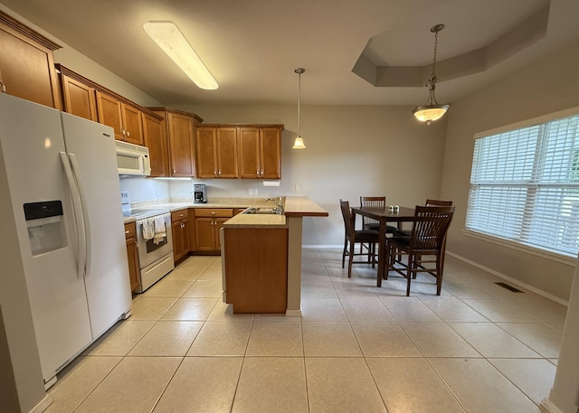 1352 N Sandy Creek Cir Unit 3, Nixa, MO 65714 - kitchen featuring white appliances, a peninsula, brown cabinetry, light countertops, and light tile patterned floors
