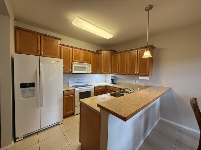 1352 N Sandy Creek Cir Unit 3, Nixa, MO 65714 - kitchen featuring white appliances, brown cabinetry, light tile patterned floors, a peninsula, and decorative light fixtures