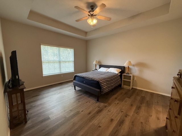 1352 N Sandy Creek Cir Unit 3, Nixa, MO 65714 - bedroom with a tray ceiling, wood finished floors, and ceiling fan