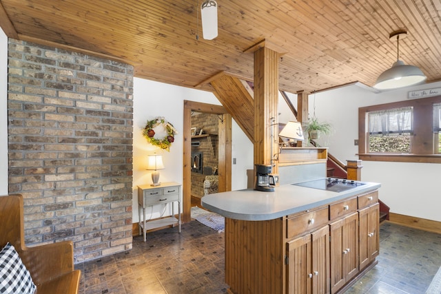 400 E Walker St, Ash Grove, MO 65604 - kitchen featuring black electric stovetop, wood ceiling, decorative light fixtures, brown cabinets, and light countertops