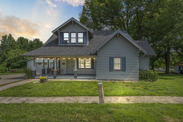 400 E Walker St, Ash Grove, MO 65604 - view of front of house with covered porch, roof with shingles, and a front lawn