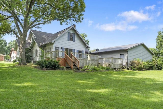 400 E Walker St, Ash Grove, MO 65604 - back of property featuring a deck and a lawn