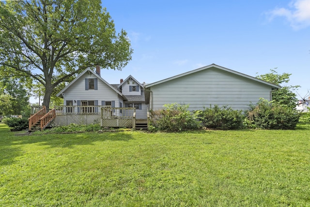400 E Walker St, Ash Grove, MO 65604 - back of house featuring a wooden deck and a yard