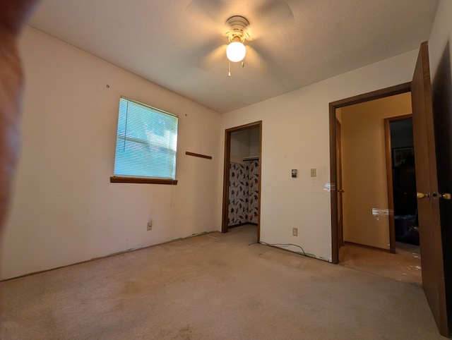 1202 S 11th St, Ozark, MO 65721 - unfurnished bedroom featuring light carpet and ceiling fan