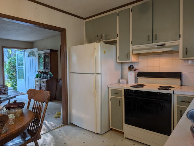 1202 S 11th St, Ozark, MO 65721 - kitchen with under cabinet range hood, freestanding refrigerator, electric stove, crown molding, and backsplash