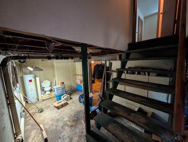 1202 S 11th St, Ozark, MO 65721 - unfinished below grade area featuring electric water heater and stairway