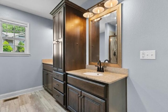 223 Roundhill Rd, Branson, MO 65616 - full bath featuring double vanity and wood finished floors