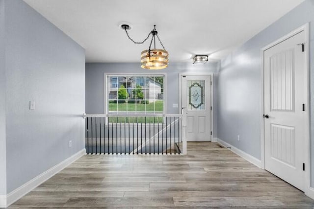 223 Roundhill Rd, Branson, MO 65616 - entryway featuring a chandelier and wood finished floors