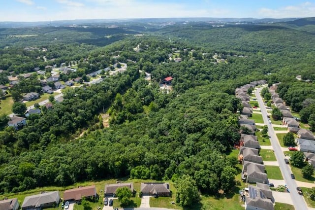 223 Roundhill Rd, Branson, MO 65616 - aerial view of property's location featuring a heavily wooded area and nearby suburban area