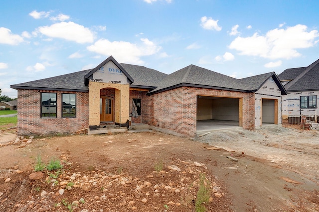 LOT20 N Silver Charm Ave, Springfield, MO 65802 - unfinished property featuring brick siding, a shingled roof, an attached garage, and driveway