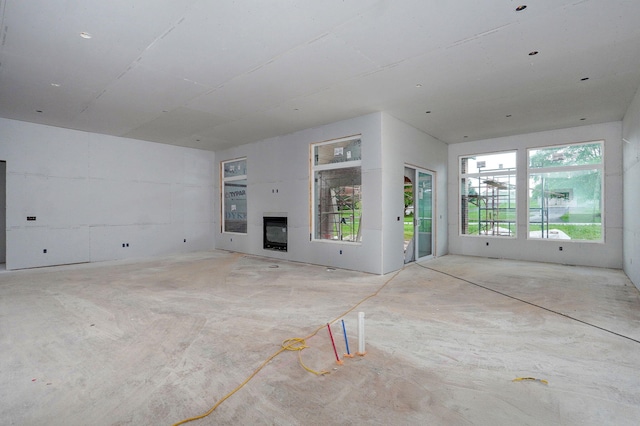LOT20 N Silver Charm Ave, Springfield, MO 65802 - unfurnished living room featuring a glass covered fireplace