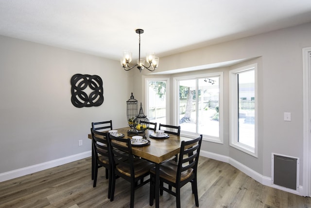 3457 S Barnes Ave, Springfield, MO 65804 - dining room featuring a chandelier and wood finished floors
