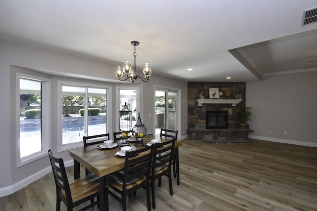 3457 S Barnes Ave, Springfield, MO 65804 - dining space featuring a chandelier, wood finished floors, recessed lighting, and a fireplace
