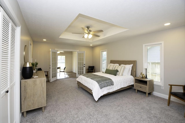 3457 S Barnes Ave, Springfield, MO 65804 - bedroom with light carpet, french doors, a raised ceiling, recessed lighting, and ceiling fan