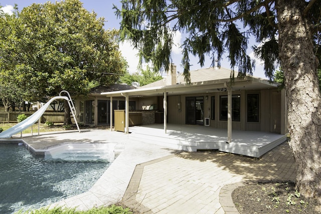 3457 S Barnes Ave, Springfield, MO 65804 - back of property featuring a chimney, a patio, a deck, and french doors