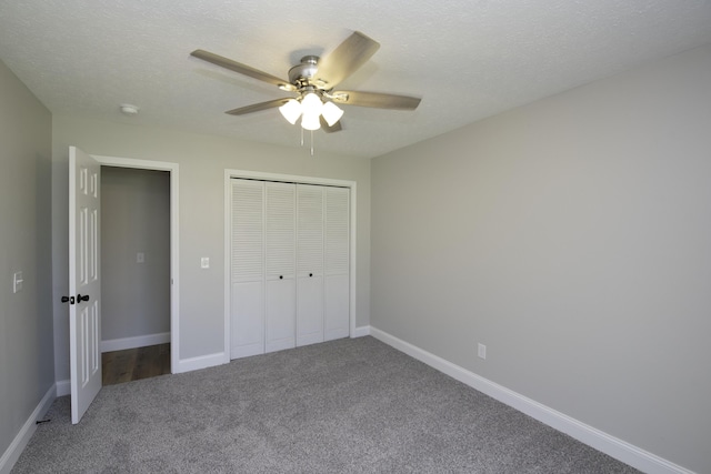 3457 S Barnes Ave, Springfield, MO 65804 - unfurnished bedroom featuring carpet, a closet, a ceiling fan, and a textured ceiling