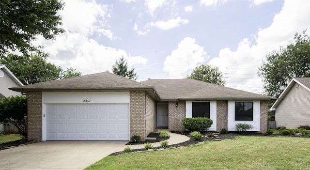 3457 S Barnes Ave, Springfield, MO 65804 - ranch-style home with brick siding, a garage, concrete driveway, a front lawn, and a shingled roof