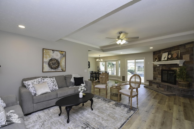 3457 S Barnes Ave, Springfield, MO 65804 - living room with a raised ceiling, wood finished floors, crown molding, ceiling fan, and recessed lighting