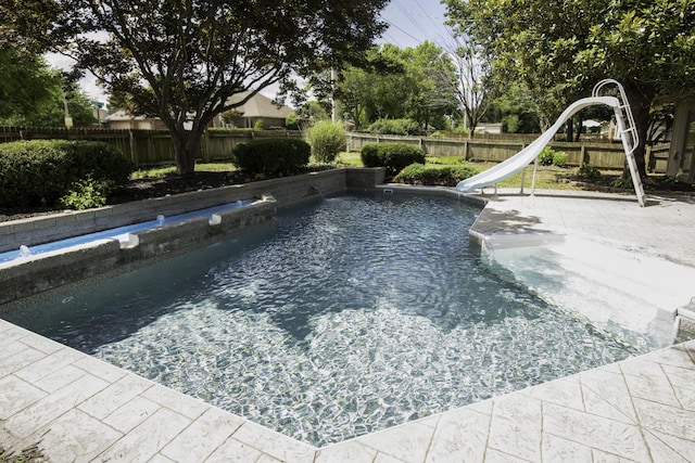3457 S Barnes Ave, Springfield, MO 65804 - view of swimming pool with a water slide and a fenced backyard