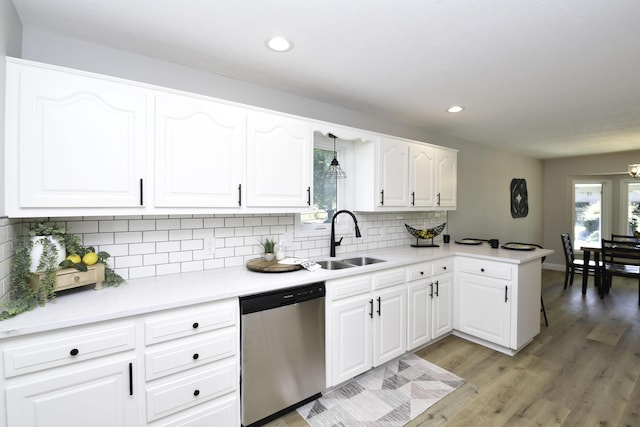 3457 S Barnes Ave, Springfield, MO 65804 - kitchen with stainless steel dishwasher, light wood-style floors, recessed lighting, backsplash, and a peninsula